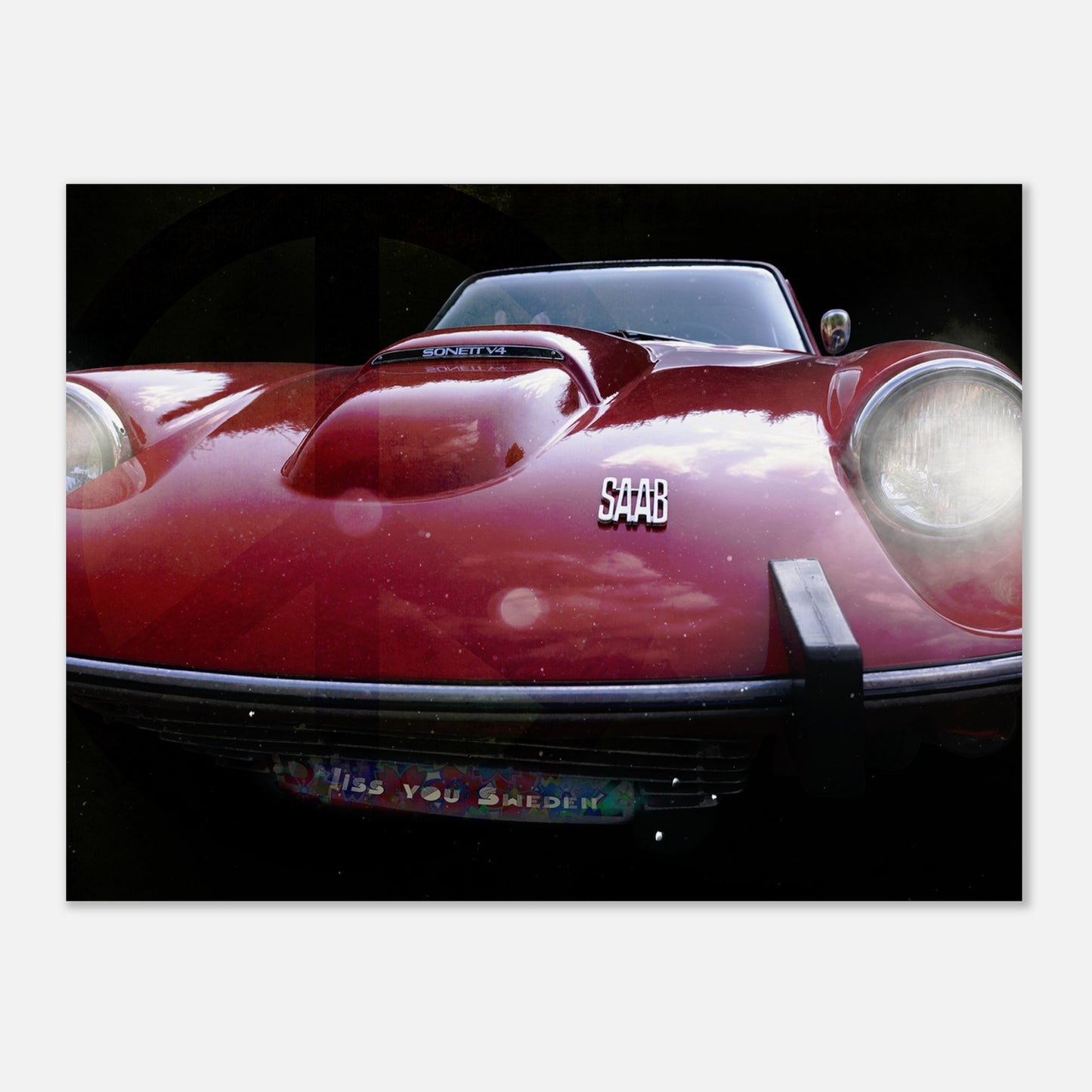 Foto på en röd saab sonett med lysande lyktor