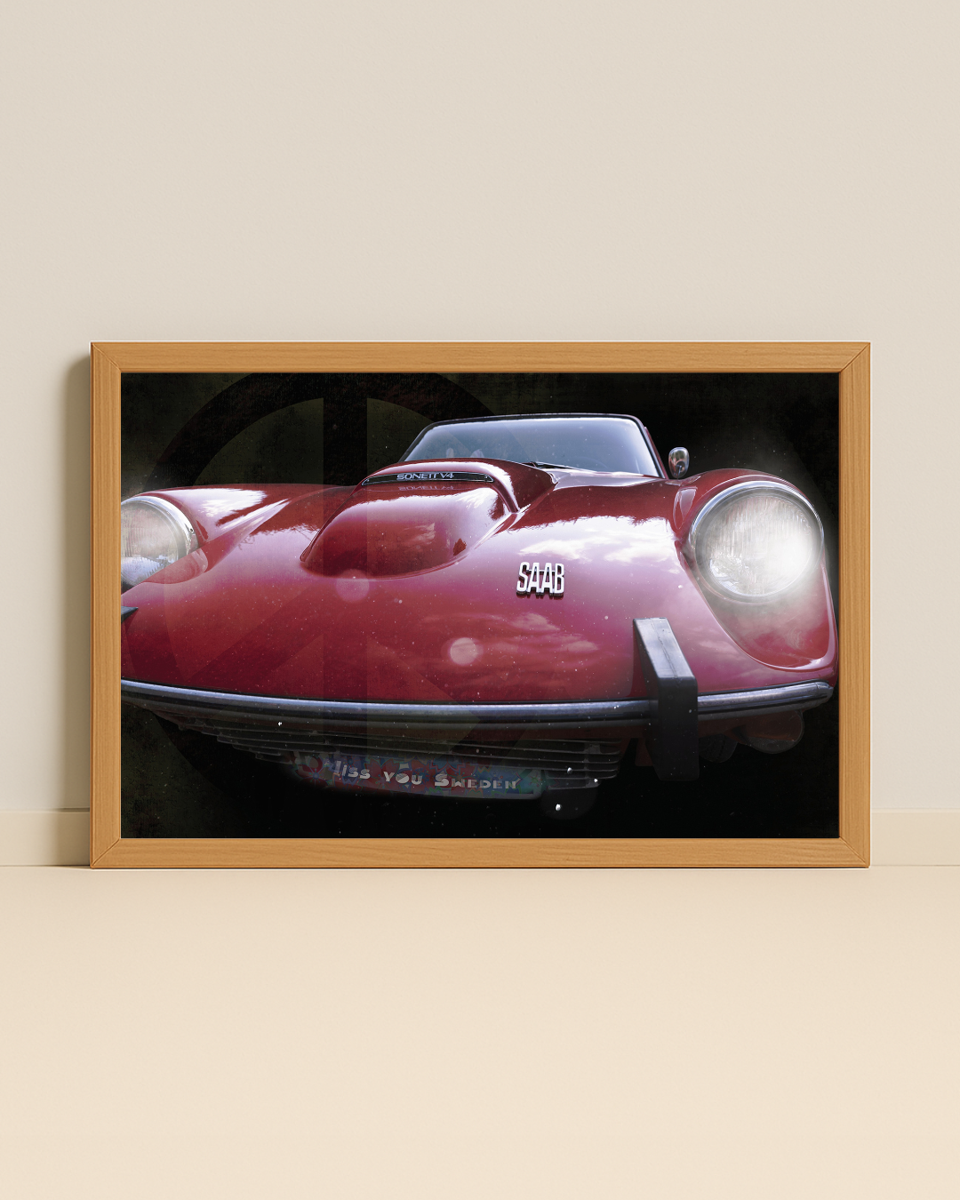 Fotografi på en röd saab sonett inramad