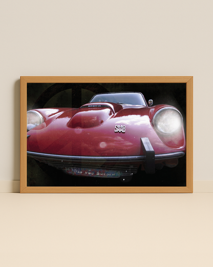 Fotografi på en röd saab sonett inramad